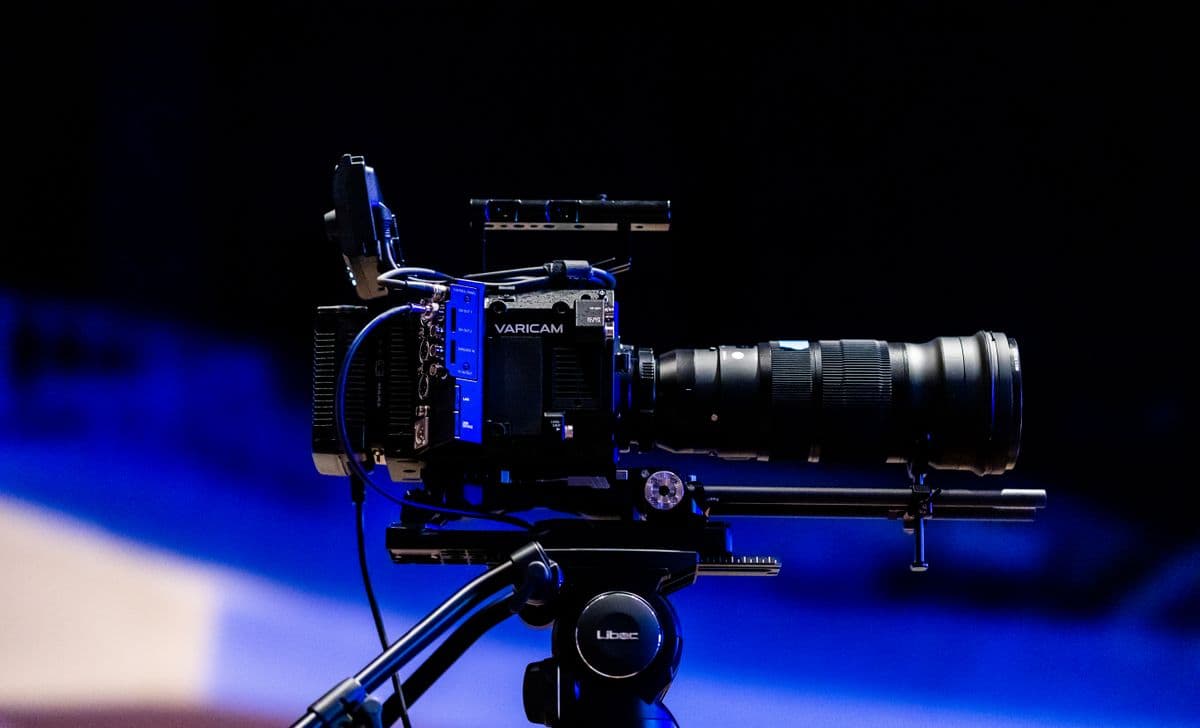 Professional video camera on tripod representing video data collection services for AI training
