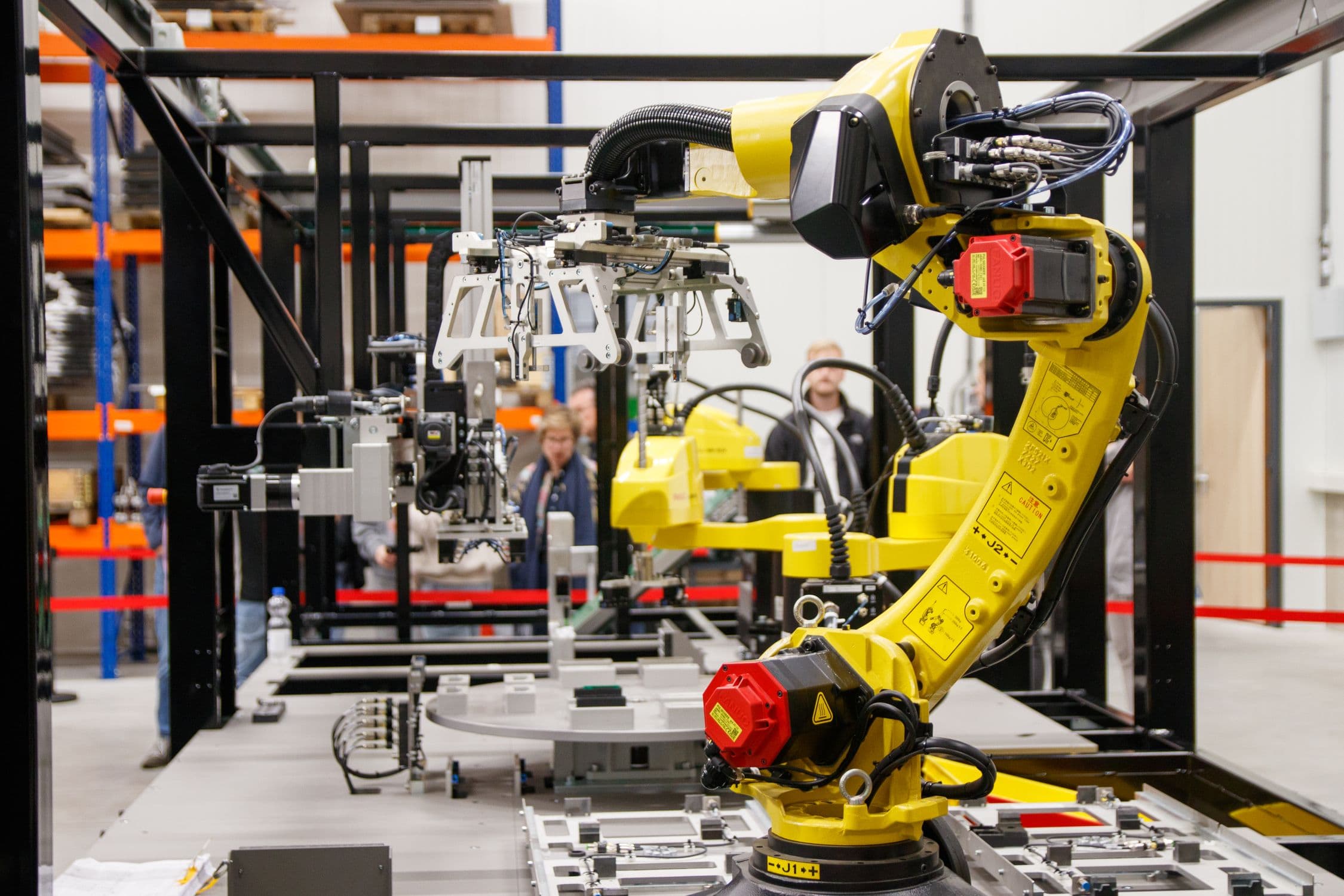 Industrial robotic arm performing precision manufacturing task - representing contact force data collection for robot training programs