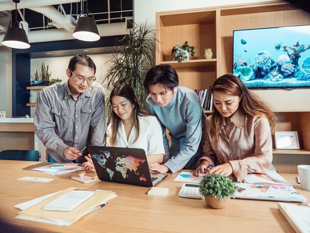 Professional team collaborating on technology data project - representing data annotation services for Chinese robotics AI companies