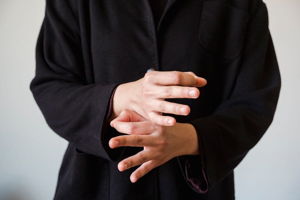 Close-up of a person making a hand gesture, the kind of footage collected for a hand gesture dataset