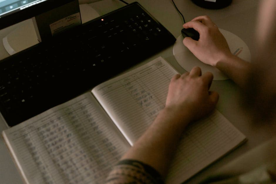 Person reviewing data on a screen with hand on mouse – representing human-in-the-loop quality assurance for production AI systems