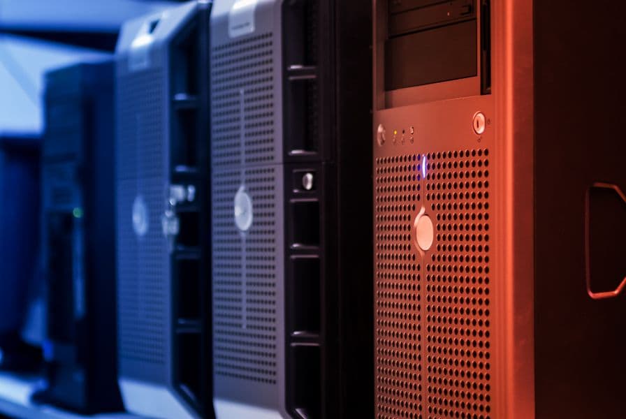 Server racks in a data center with blue and red lighting