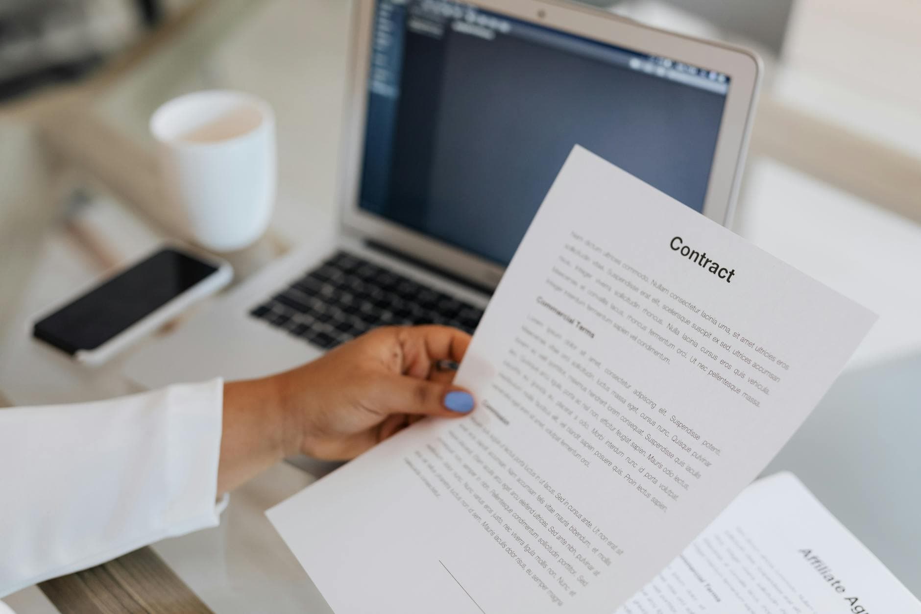 Data annotation SLA vendor contract review – legal documents and laptop on a desk