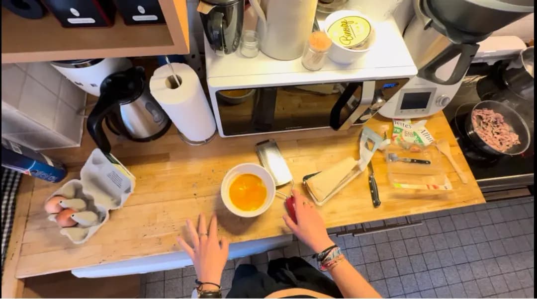 First-person egocentric POV footage of a kitchen cooking activity - example of daily-life video data collection for robot and embodied AI training