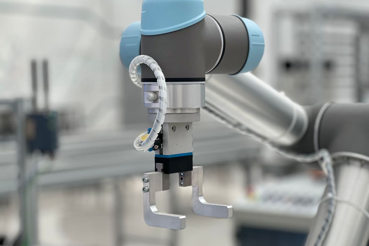 Robotic arm in industrial setting representing robot training data collection for enterprise AI programs
