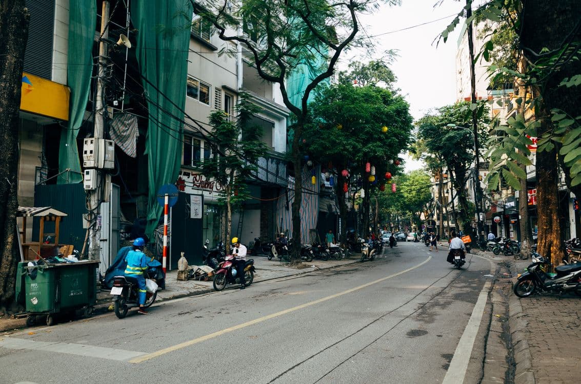 Busy Hanoi street with mixed motorbike and pedestrian traffic - the kind of unstructured urban environment used in robot training data collection programs
