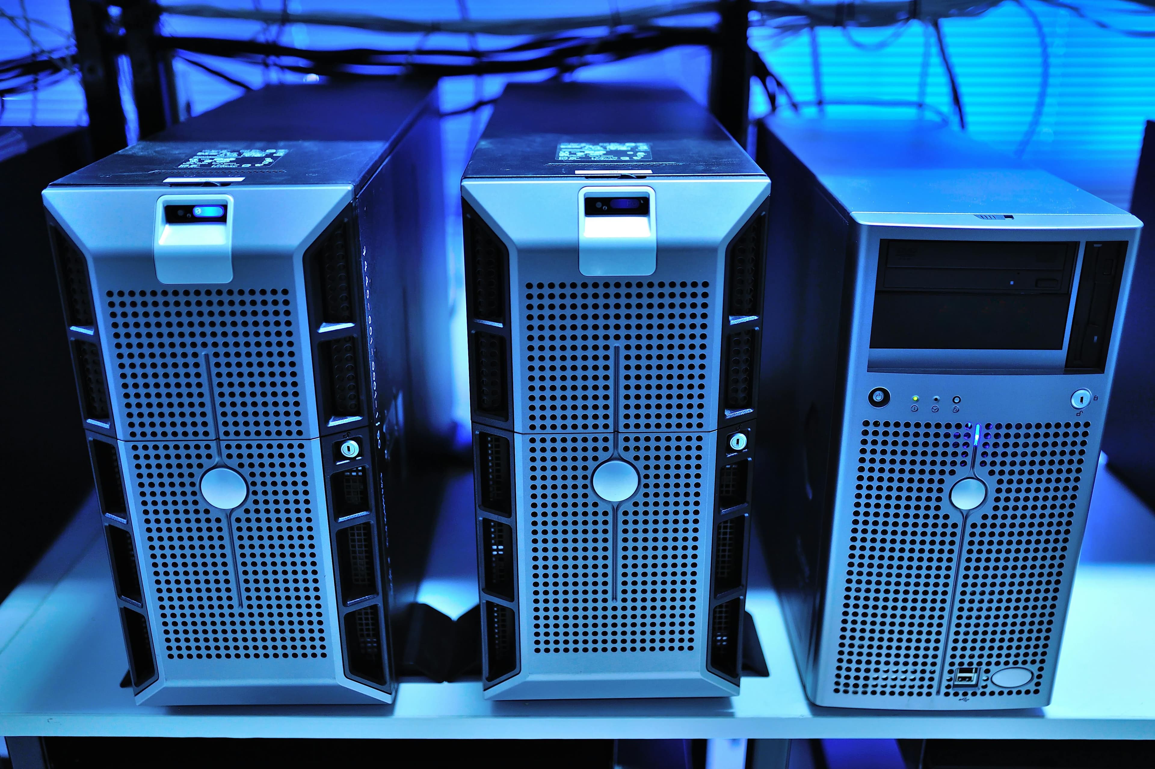 Server towers in a blue-lit data centre